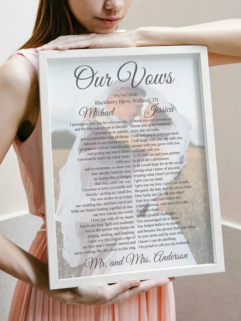 Personalized anniversary sign in white frame with custom photo, vows, names, date, and location, held by young woman.