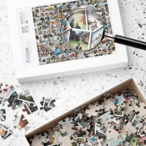 Custom photo collage jigsaw puzzle on table with magnifying glass highlighting personalized design and loose puzzle pieces inside and outside the accompanying box.